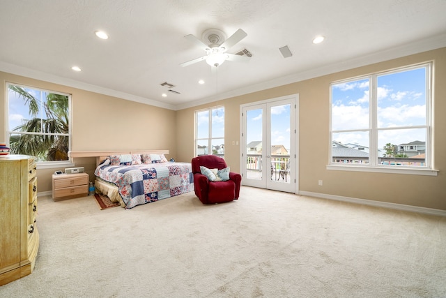 1854 Tiki Dr, Tiki Island, TX 77554 - bedroom with access to outside, multiple windows, light carpet, recessed lighting, and crown molding