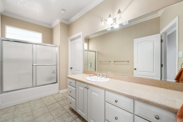 1854 Tiki Dr, Tiki Island, TX 77554 - bathroom with vanity, ornamental molding, combined bath / shower with glass door, tile patterned flooring, and baseboards
