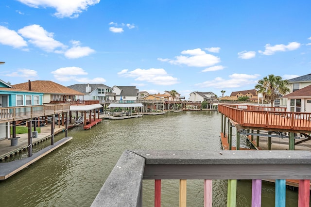 1854 Tiki Dr, Tiki Island, TX 77554 - dock area with a residential view and a water view