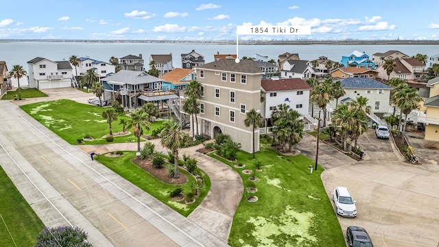 1854 Tiki Dr, Tiki Island, TX 77554 - aerial perspective of suburban area with a nearby body of water