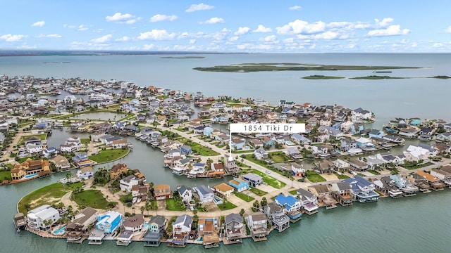 1854 Tiki Dr, Tiki Island, TX 77554 - aerial overview of property's location featuring a nearby body of water and nearby suburban area