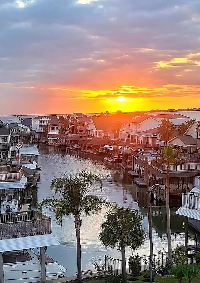 1854 Tiki Dr, Tiki Island, TX 77554 - dock featuring a residential view and a water view