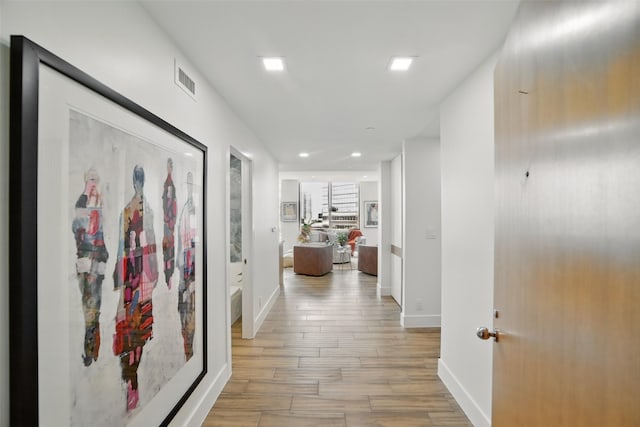5110 San Felipe St Unit 97W, Houston, TX 77056 - hall featuring light wood-style flooring, baseboards, and recessed lighting