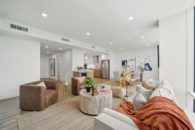 5110 San Felipe St Unit 97W, Houston, TX 77056 - living area with light wood-style floors, recessed lighting, and baseboards
