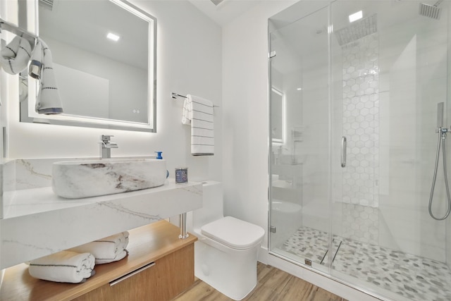 5110 San Felipe St Unit 97W, Houston, TX 77056 - full bathroom featuring toilet, wood finished floors, a shower stall, and vanity