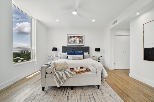 5110 San Felipe St Unit 97W, Houston, TX 77056 - bedroom with wood finished floors, baseboards, ceiling fan, and recessed lighting