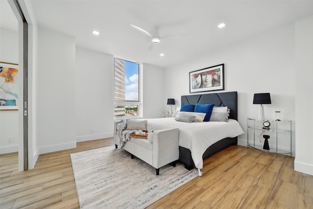 5110 San Felipe St Unit 97W, Houston, TX 77056 - bedroom with light wood finished floors, baseboards, recessed lighting, and a ceiling fan
