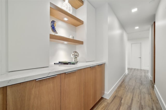 5110 San Felipe St Unit 97W, Houston, TX 77056 - bar area with light wood-style flooring and baseboards