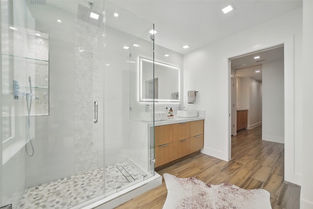 5110 San Felipe St Unit 97W, Houston, TX 77056 - full bath featuring wood finished floors, vanity, a shower stall, baseboards, and recessed lighting