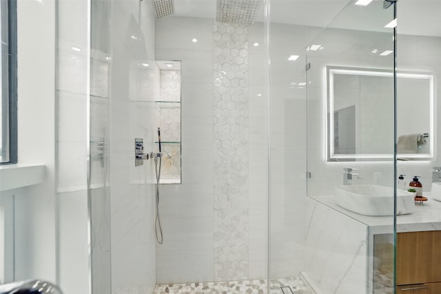 5110 San Felipe St Unit 97W, Houston, TX 77056 - bathroom featuring a stall shower and vanity