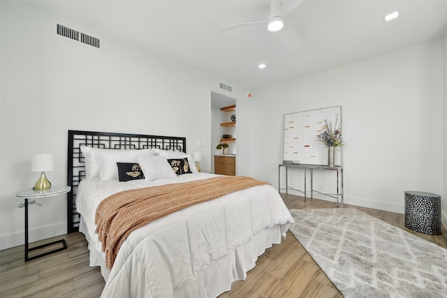 5110 San Felipe St Unit 97W, Houston, TX 77056 - bedroom featuring wood finished floors, ceiling fan, baseboards, and recessed lighting