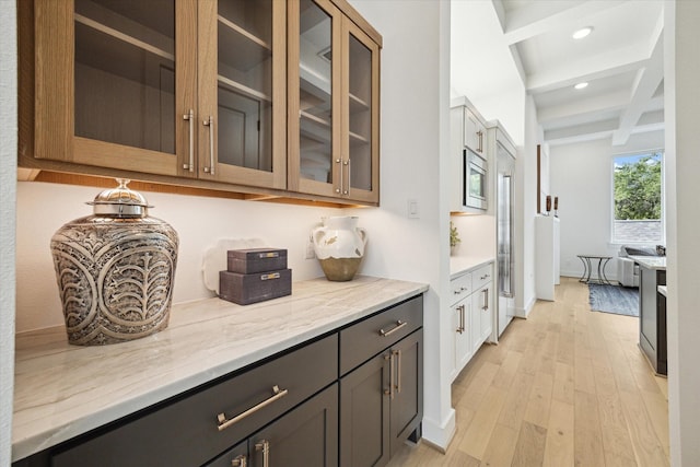 1115 Potomac Dr Unit B, Houston, TX 77057 - bar area with stainless steel microwave, beam ceiling, light wood-style flooring, and recessed lighting