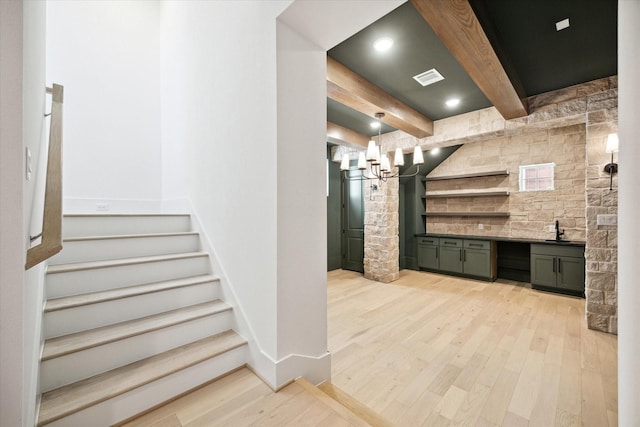 1115 Potomac Dr Unit B, Houston, TX 77057 - indoor bar with light wood-style flooring, stairway, beamed ceiling, and a chandelier