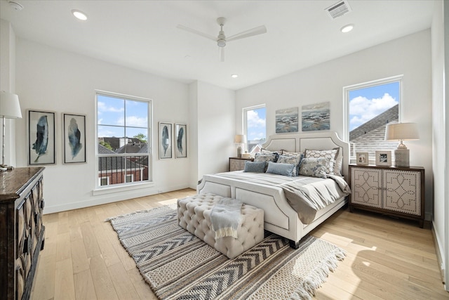 1115 Potomac Dr Unit B, Houston, TX 77057 - bedroom featuring multiple windows, light wood-style flooring, recessed lighting, a ceiling fan, and baseboards