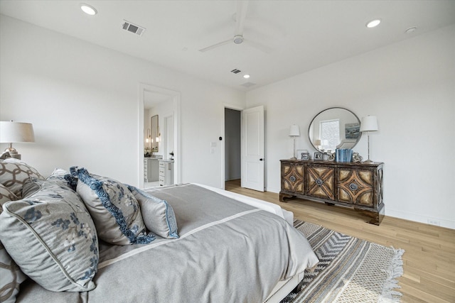 1115 Potomac Dr Unit B, Houston, TX 77057 - bedroom featuring wood finished floors, recessed lighting, connected bathroom, a ceiling fan, and baseboards