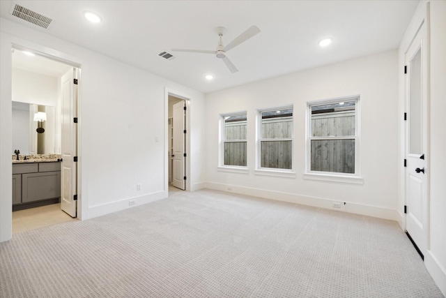 1115 Potomac Dr Unit B, Houston, TX 77057 - unfurnished bedroom featuring light colored carpet, baseboards, recessed lighting, a ceiling fan, and ensuite bathroom