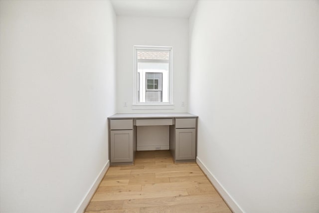 1115 Potomac Dr Unit B, Houston, TX 77057 - corridor featuring light wood finished floors, an office area, and baseboards