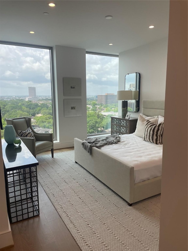 5656 San Felipe St Unit 1301, Houston, TX 77056 - bedroom with recessed lighting, wood finished floors, a view of city, and floor to ceiling windows