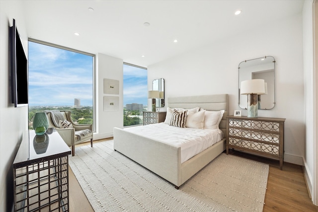 5656 San Felipe St Unit 1301, Houston, TX 77056 - bedroom with wood finished floors and recessed lighting