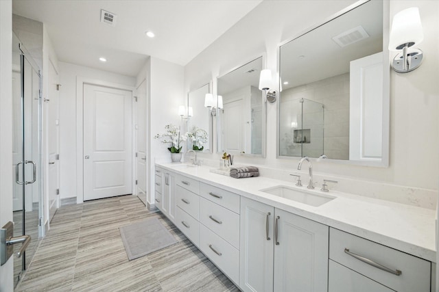 5656 San Felipe St Unit 1301, Houston, TX 77056 - bathroom with a stall shower, double vanity, and recessed lighting