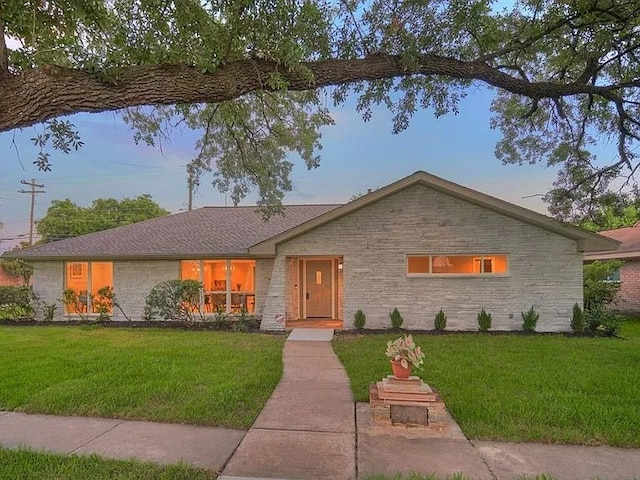 4003 Mischire Dr, Houston, TX 77025 - view of front of house featuring a front lawn and stone siding