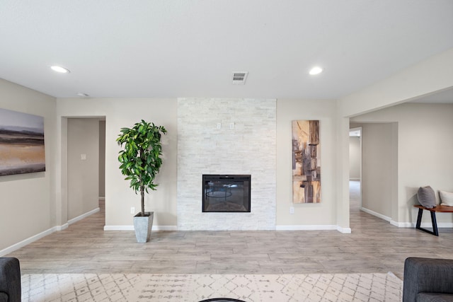 4003 Mischire Dr, Houston, TX 77025 - living room with wood finished floors, a fireplace, recessed lighting, and baseboards