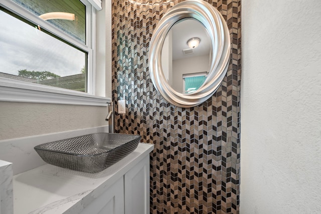 4003 Mischire Dr, Houston, TX 77025 - bathroom featuring a textured wall and a sink