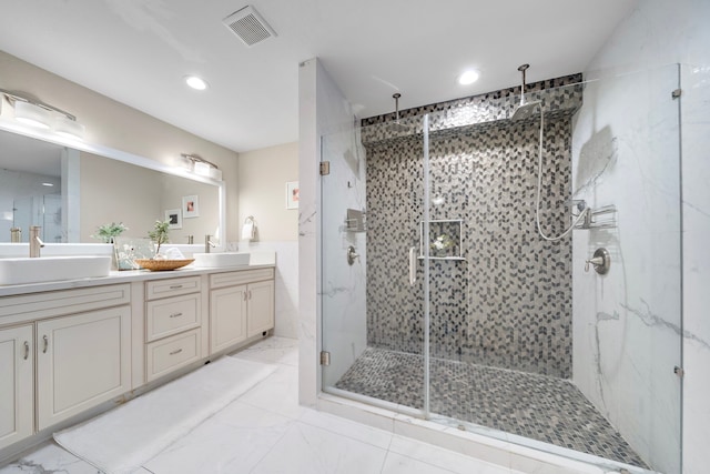 4003 Mischire Dr, Houston, TX 77025 - full bathroom featuring a marble finish shower, marble look tiles, double vanity, and recessed lighting