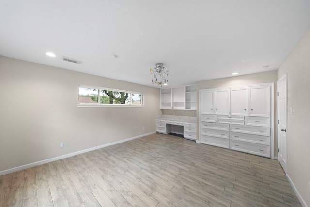 4003 Mischire Dr, Houston, TX 77025 - unfurnished living room featuring baseboards, light wood finished floors, and recessed lighting