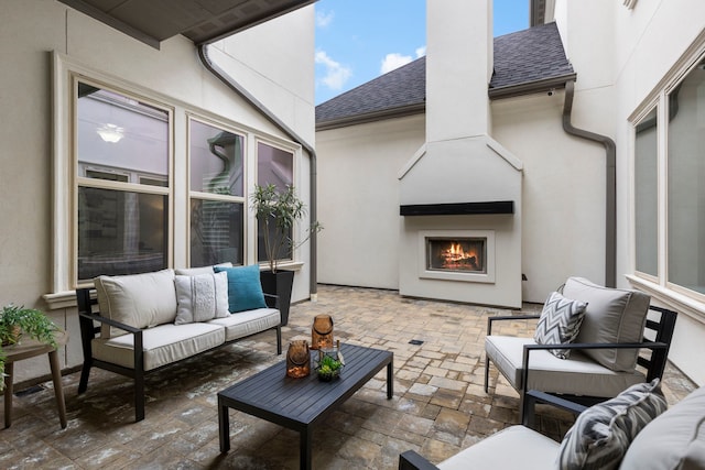 74 N Curly Willow Cir, Tomball, TX 77375 - view of patio / terrace featuring an outdoor living space with a fireplace