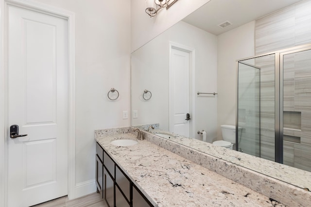 74 N Curly Willow Cir, Tomball, TX 77375 - bathroom with vanity, a stall shower, toilet, and baseboards