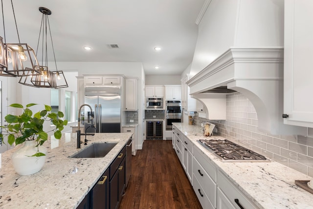 74 N Curly Willow Cir, Tomball, TX 77375 - kitchen with stainless steel appliances, a sink, wine cooler, dark wood-style floors, and white cabinets