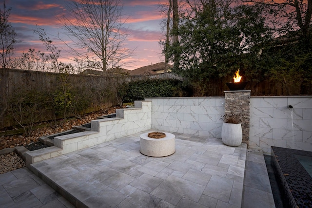 74 N Curly Willow Cir, Tomball, TX 77375 - fenced backyard featuring a fire pit and a patio area