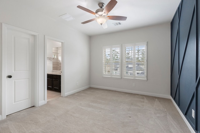 74 N Curly Willow Cir, Tomball, TX 77375 - unfurnished bedroom with light colored carpet, baseboards, ensuite bathroom, and ceiling fan