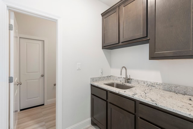 74 N Curly Willow Cir, Tomball, TX 77375 - washroom with a sink and baseboards