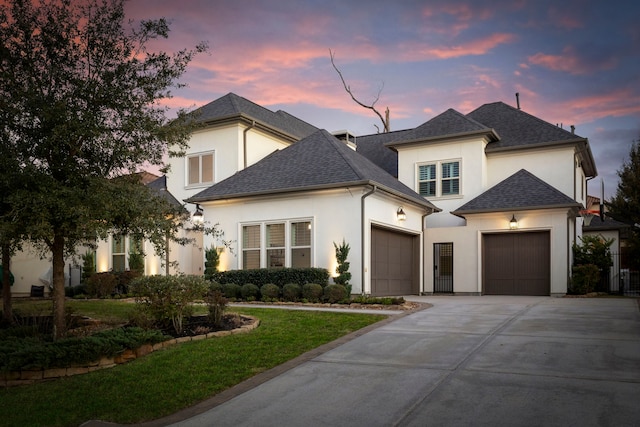 74 N Curly Willow Cir, Tomball, TX 77375 - french country style house featuring stucco siding, an attached garage, driveway, a shingled roof, and a front yard