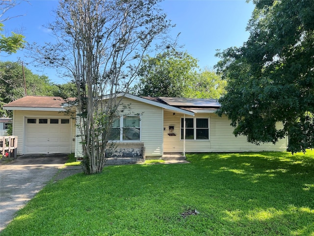 3508 Meadowlane St, Victoria, TX 77901 - single story home with roof mounted solar panels, a garage, driveway, and a front yard