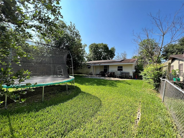 3508 Meadowlane St, Victoria, TX 77901 - view of yard with a trampoline and a patio