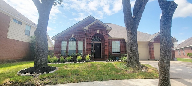 4315 Aspen Ct, Missouri City, TX 77459 - view of front of house with brick siding, concrete driveway, an attached garage, and a front lawn