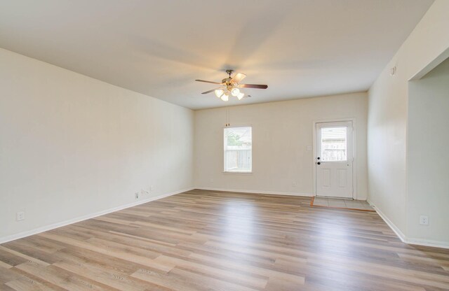 3102 Gianna Springs Ct, Humble, TX 77396 - empty room with a ceiling fan, light wood-style floors, and baseboards