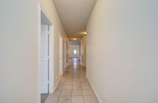 3102 Gianna Springs Ct, Humble, TX 77396 - hall featuring light tile patterned flooring and baseboards