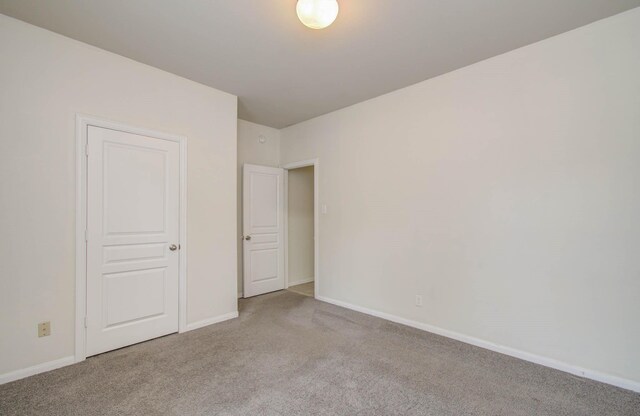 3102 Gianna Springs Ct, Humble, TX 77396 - unfurnished bedroom with carpet and baseboards