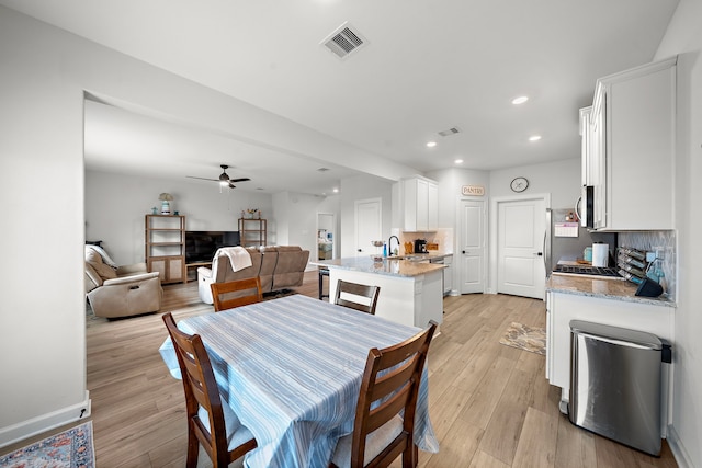 14122 Freeboard Dr, Santa Fe, TX 77510 - dining area with ceiling fan, light wood finished floors, and recessed lighting