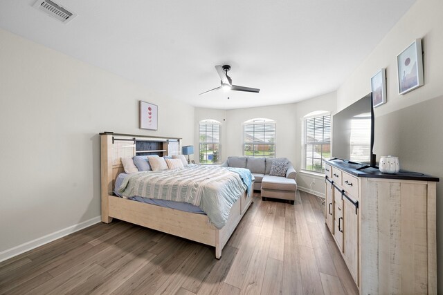 14122 Freeboard Dr, Santa Fe, TX 77510 - bedroom with light wood-type flooring, baseboards, and a ceiling fan