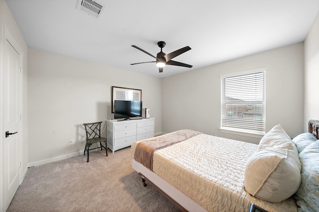 14122 Freeboard Dr, Santa Fe, TX 77510 - bedroom featuring light colored carpet, baseboards, and ceiling fan