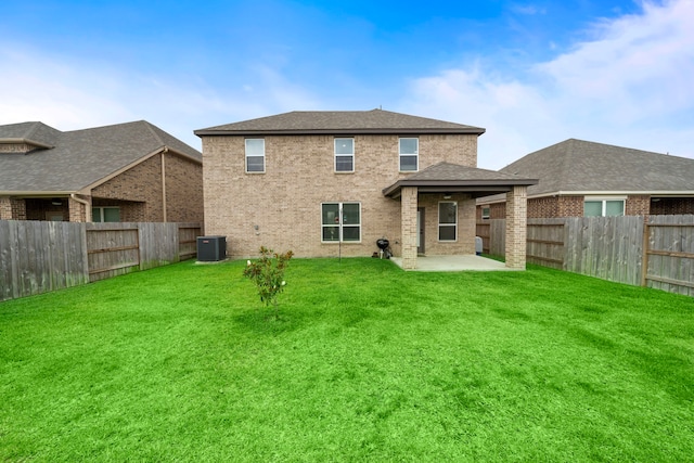14122 Freeboard Dr, Santa Fe, TX 77510 - rear view of house with central AC, a patio area, and brick siding