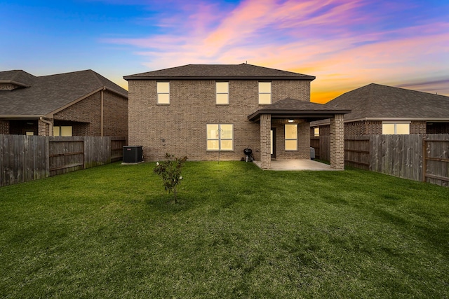 14122 Freeboard Dr, Santa Fe, TX 77510 - back of house with cooling unit, a patio area, and brick siding