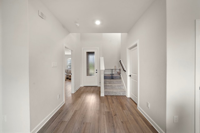 14122 Freeboard Dr, Santa Fe, TX 77510 - hallway featuring wood finished floors, baseboards, and stairway
