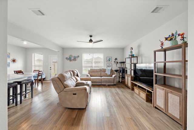 14122 Freeboard Dr, Santa Fe, TX 77510 - living room with healthy amount of natural light, ceiling fan, and light wood-style floors