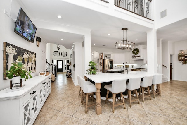 19910 Standing Cypress Dr, Spring, TX 77379 - dining room featuring stairs, light tile patterned floors, a chandelier, and recessed lighting
